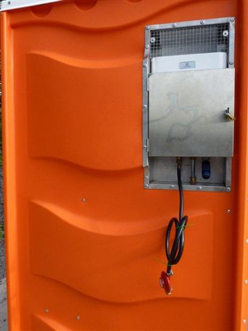 Hot Water Dispenser. Back view of Portable Toilet from Griffin Toilet Hire