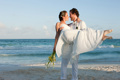 Married couple on beach Destination Wedding