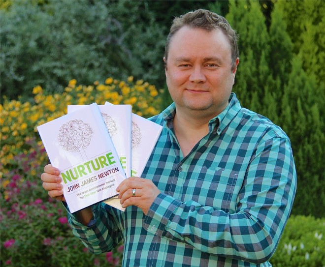 Author John James Newton With Copies of Nurture Awarded The Best Management Book of The Year Smaller