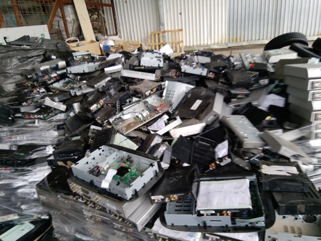A mountain of e-waste comprised of broken and old DSTV and GoTV boxes